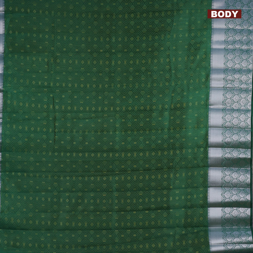 Semi raw silk saree dual shade of dark green with allover self emboss and long silver zari woven border