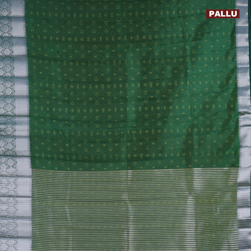 Semi raw silk saree dual shade of dark green with allover self emboss and long silver zari woven border