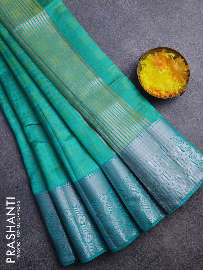 Semi raw silk saree dual shade of teal blue with allover self emboss and long silver zari woven border