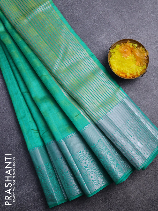 Semi raw silk saree dual shade of teal green with allover self emboss and long silver zari woven border