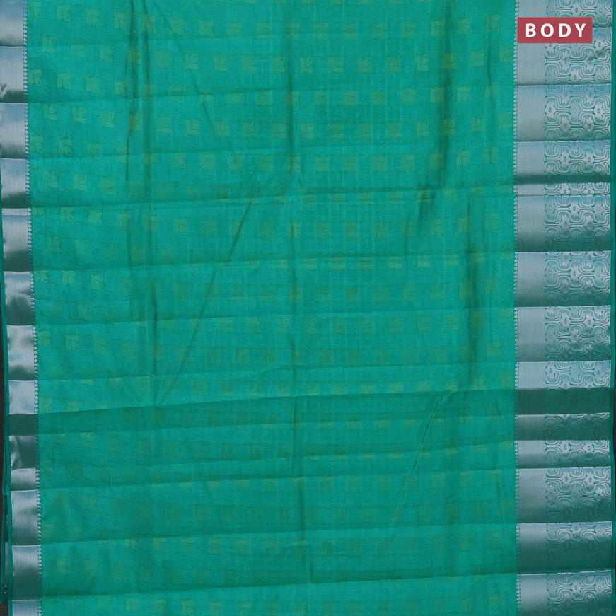 Semi raw silk saree dual shade of teal green with allover self emboss and long silver zari woven border