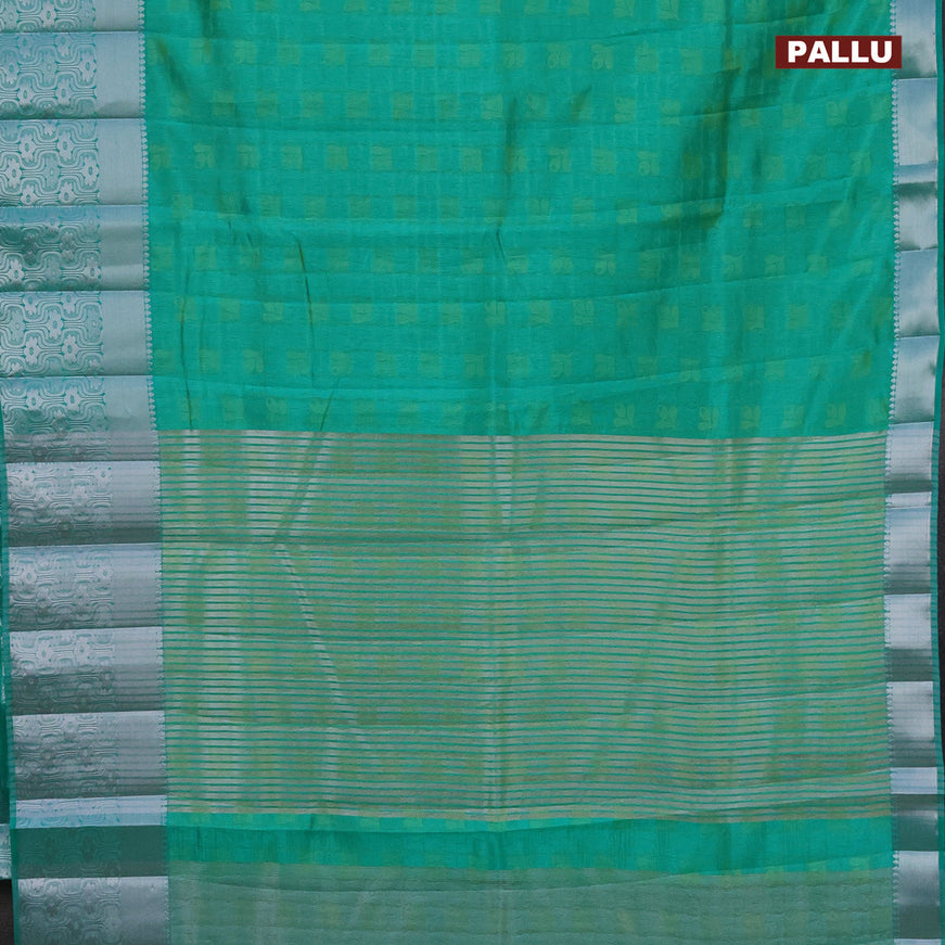 Semi raw silk saree dual shade of teal green with allover self emboss and long silver zari woven border