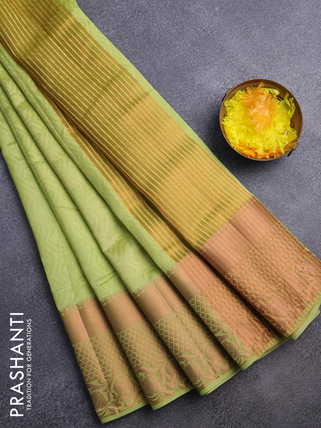 Semi raw silk saree light green with allover self emboss and long copper zari woven border