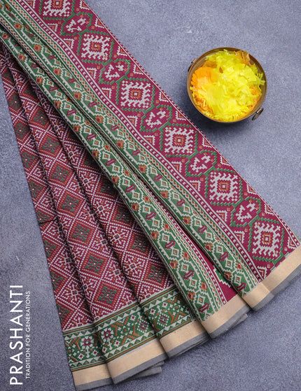 Muslin cotton saree maroon shade and green with allover ikat prints and zari woven border