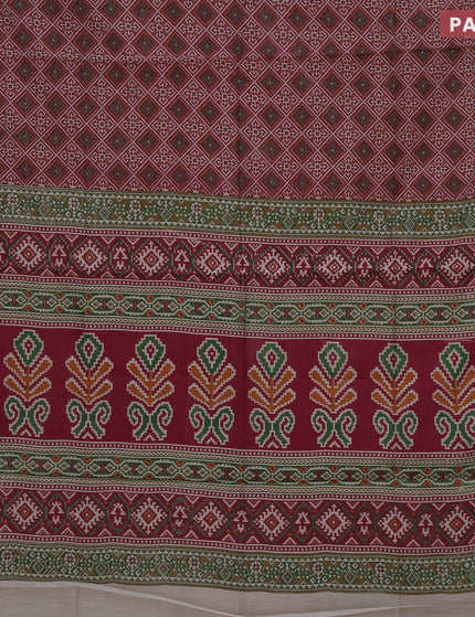 Muslin cotton saree maroon shade and green with allover ikat prints and zari woven border