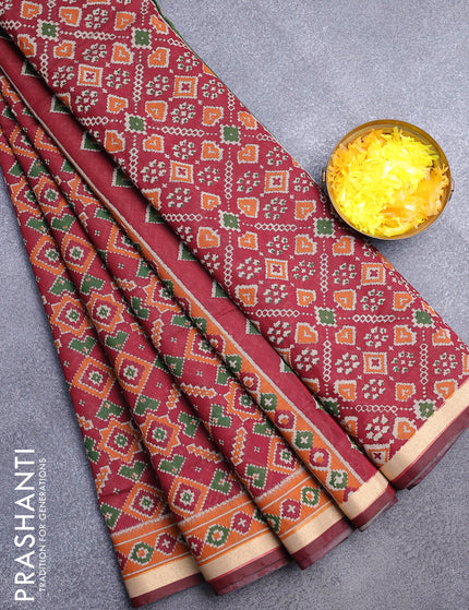 Muslin cotton saree maroon and orange with allover ikat prints and zari woven border