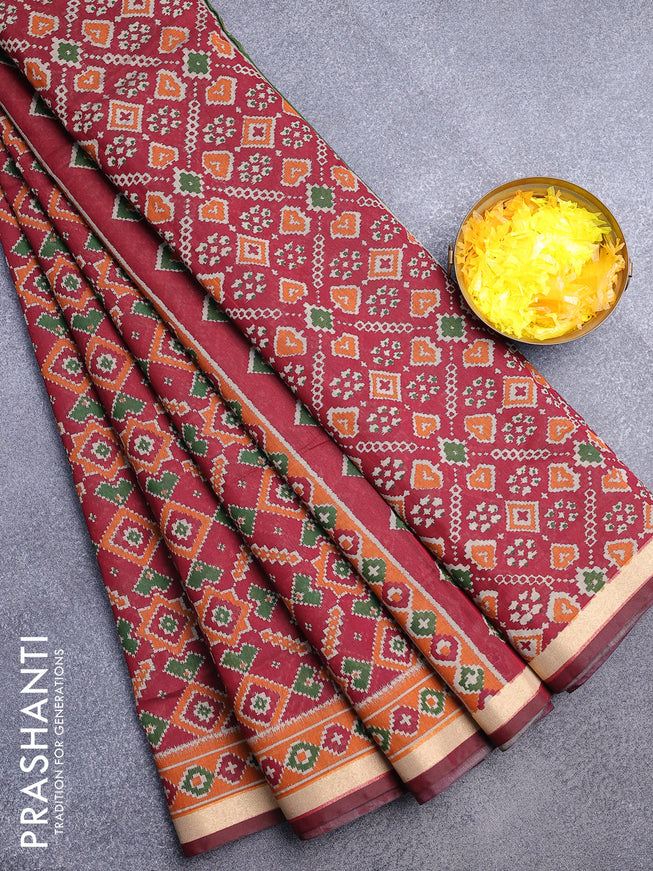 Muslin cotton saree maroon and orange with allover ikat prints and zari woven border