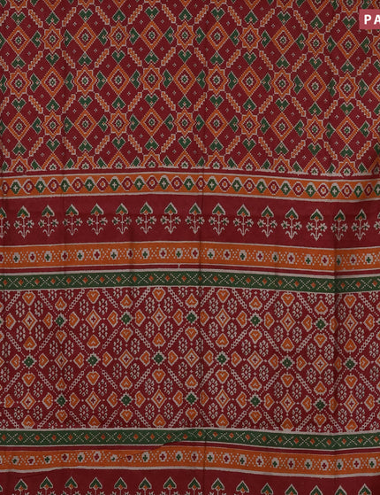 Muslin cotton saree maroon and orange with allover ikat prints and zari woven border