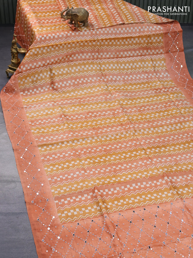 Pure tussar silk saree sandal and pastel peach with allover prints & mirror work and mirror embroidery work border