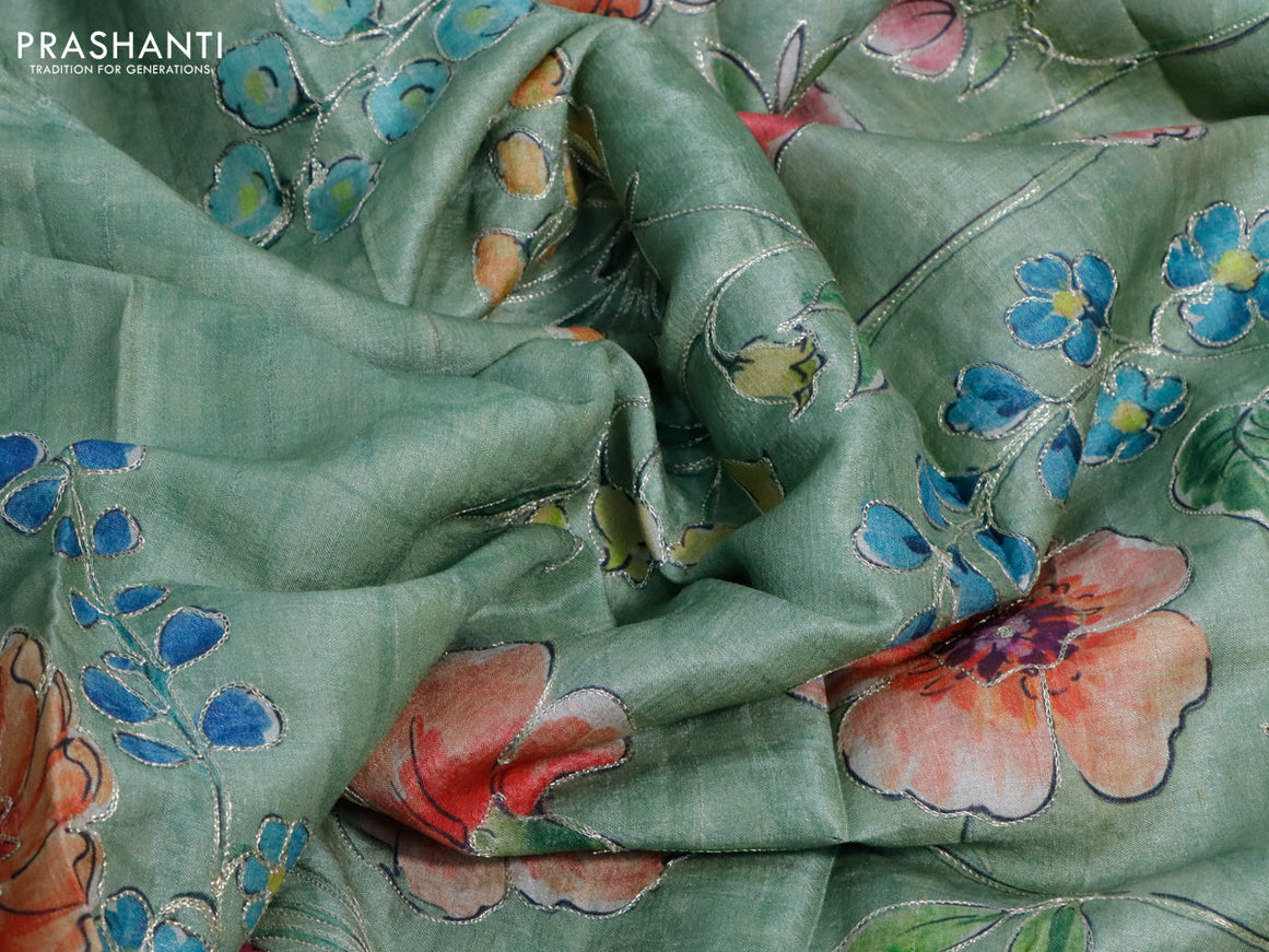 Pure tussar silk saree pastel green shade with allover floral prints & pita work and simple border