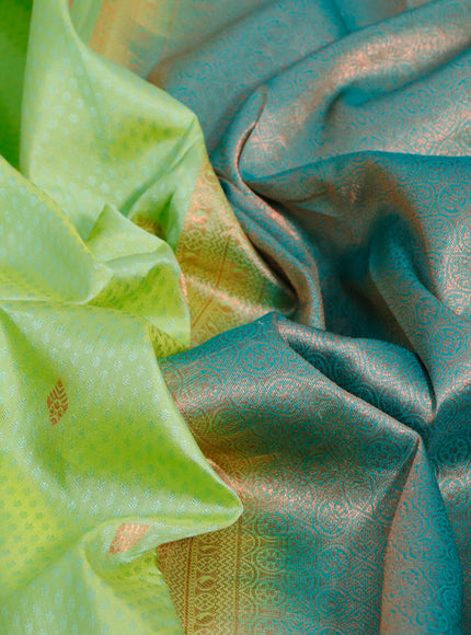 Pure kanjivaram silk saree dual shade of pista green and teal green with allover self emboss & zari buttas and long copper zari woven border