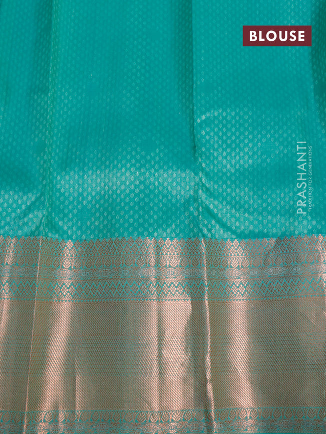 Pure kanjivaram silk saree dual shade of pista green and teal green with allover self emboss & zari buttas and long copper zari woven border