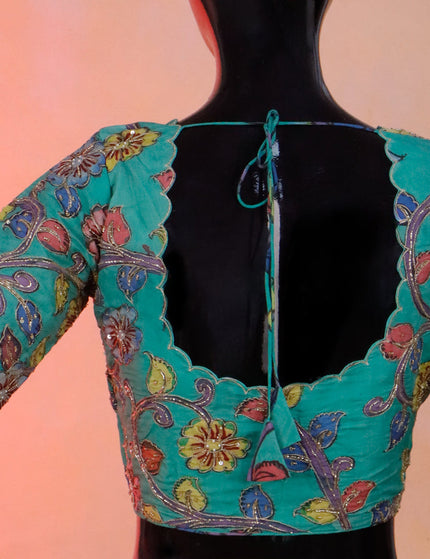 Pen kalamkari readymade blouse teal green with allover kalamkari prints & embroidery work and back knot