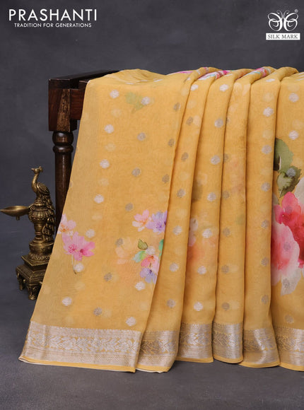 Chiffon silk saree mustard shade with floral digital prints & silver zari buttas and silver zari woven border