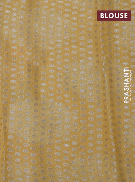 Chiffon silk saree mustard shade with floral digital prints & silver zari buttas and silver zari woven border