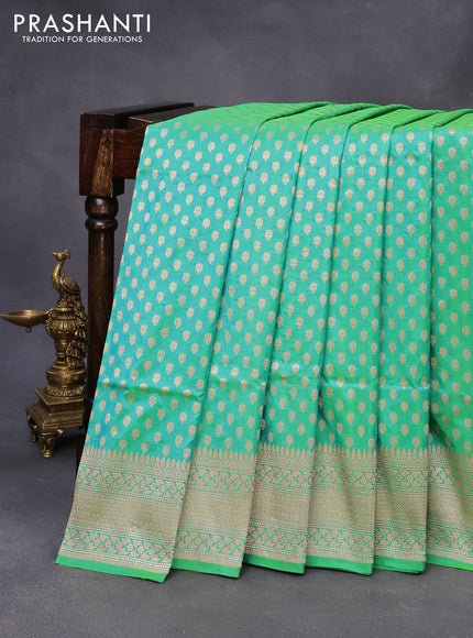 Banarasi uppada silk saree dual shade of teal greenish blue with allover zari woven buttas and zari woven border