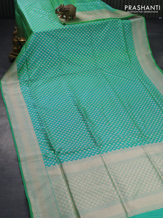 Banarasi uppada silk saree dual shade of teal greenish blue with allover zari woven buttas and zari woven border