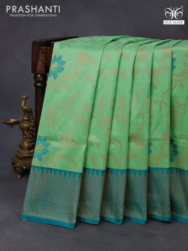 Banarasi uppada silk saree green shade and teal blue with allover floral weaves and zari woven border