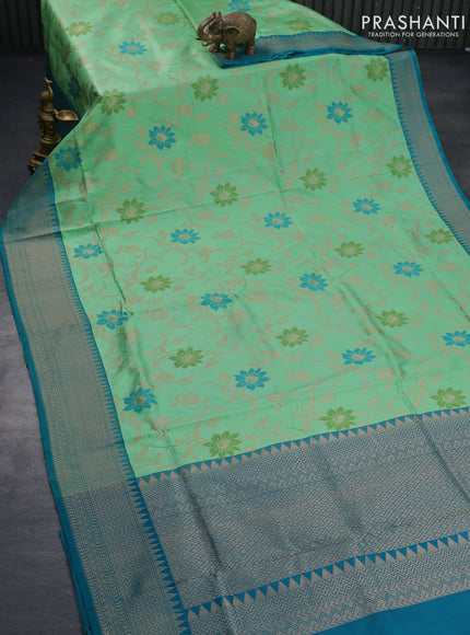 Banarasi uppada silk saree green shade and teal blue with allover floral weaves and zari woven border