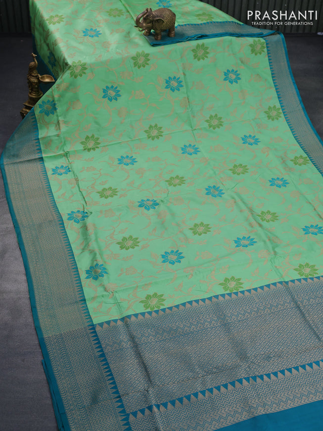 Banarasi uppada silk saree green shade and teal blue with allover floral weaves and zari woven border