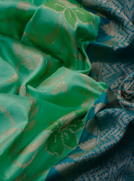 Banarasi uppada silk saree green shade and teal blue with allover floral weaves and zari woven border