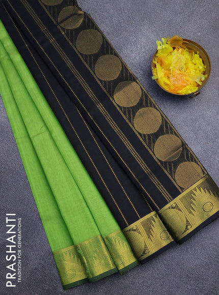 Silk cotton saree light green and black with plain body and temple & rudhraksha zari woven border