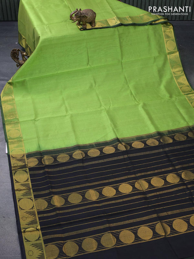 Silk cotton saree light green and black with plain body and temple & rudhraksha zari woven border