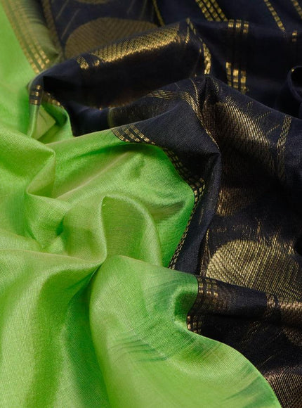 Silk cotton saree light green and black with plain body and temple & rudhraksha zari woven border