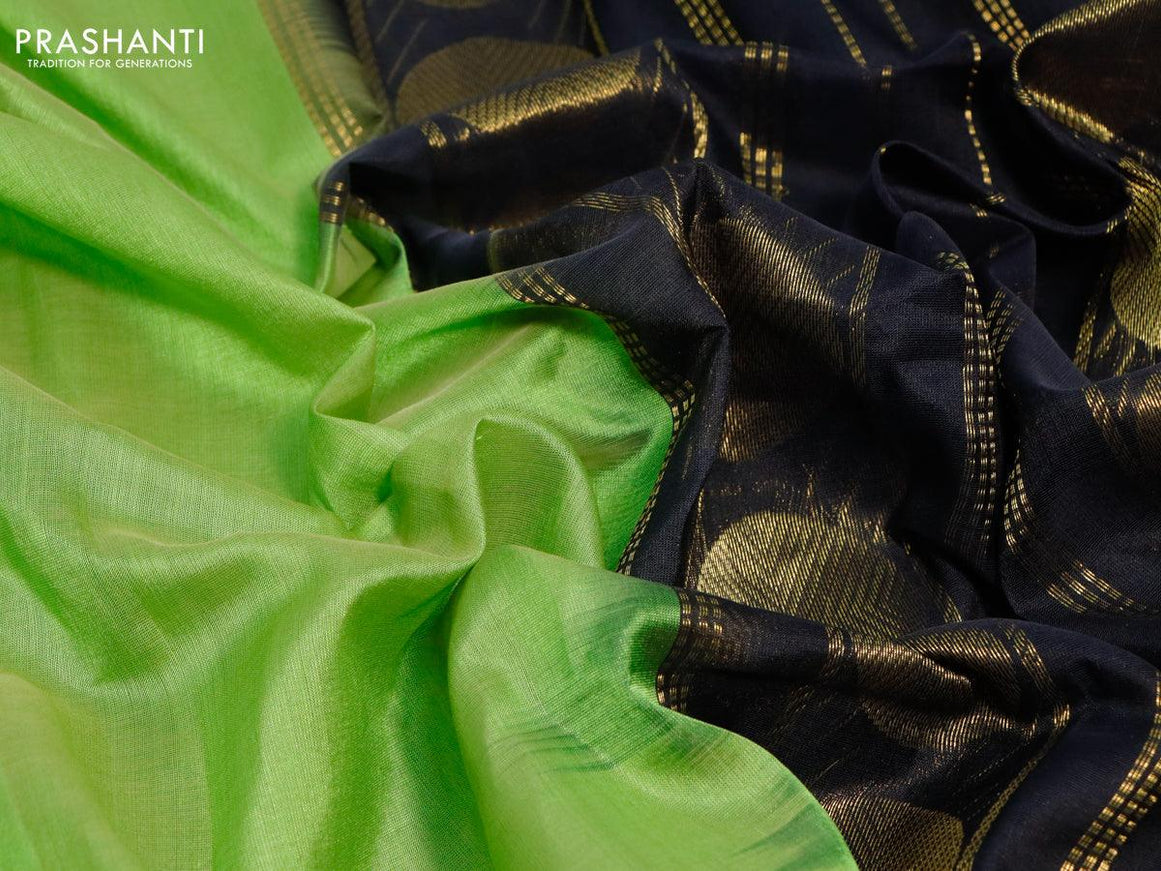 Silk cotton saree light green and black with plain body and temple & rudhraksha zari woven border