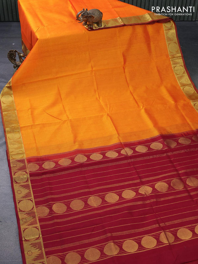 Silk cotton saree orange and maroon with plain body and temple & rudhraksha zari woven border