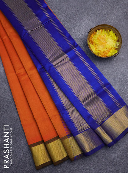 Silk cotton saree sunset orange and blue with plain body and zari woven border