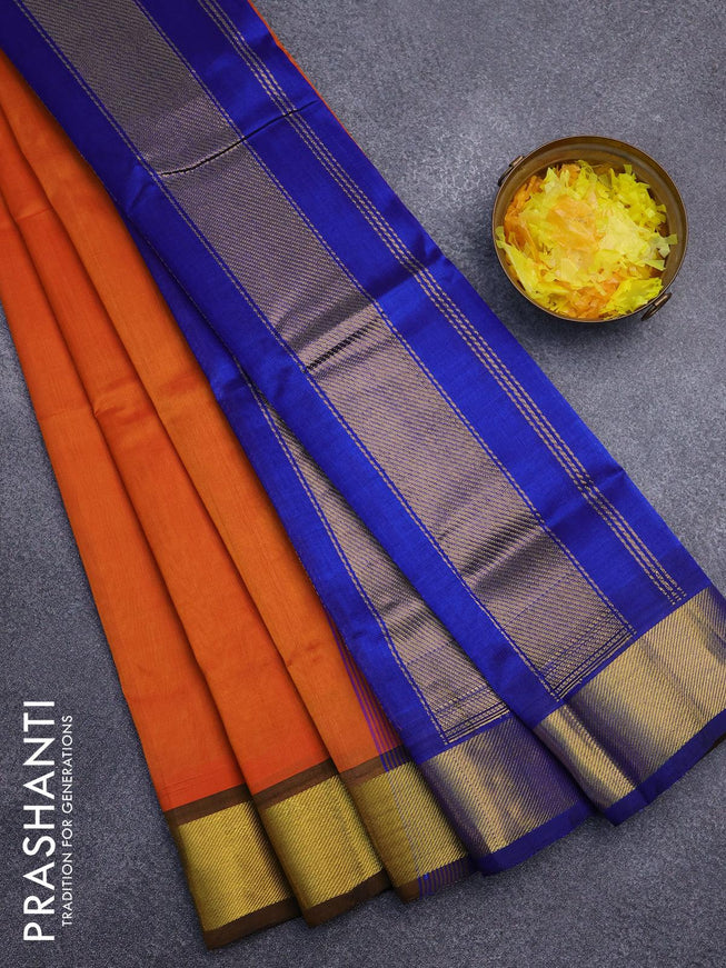 Silk cotton saree sunset orange and blue with plain body and zari woven border