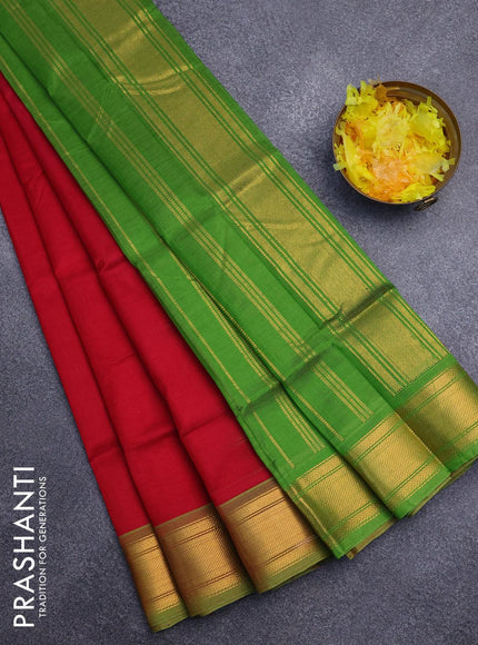 Silk cotton saree red and green with plain body and zari woven border