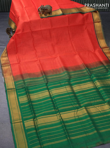 Silk cotton saree orange and green with plain body and zari woven border