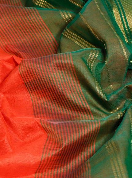 Silk cotton saree orange and green with plain body and zari woven border