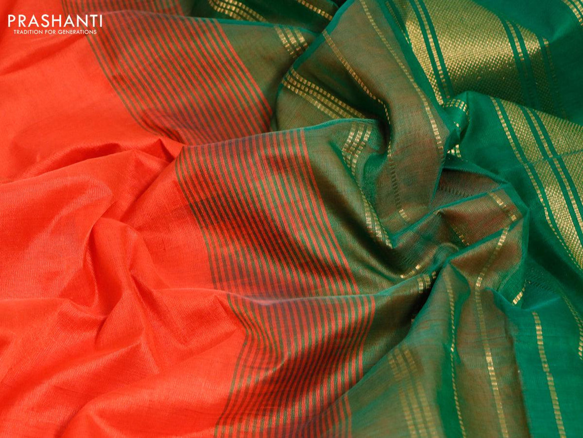 Silk cotton saree orange and green with plain body and zari woven border