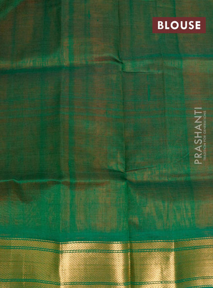 Silk cotton saree orange and green with plain body and zari woven border