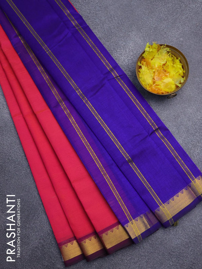 Silk cotton saree dual shade of pinkish orange and blue with plain body and small zari woven border