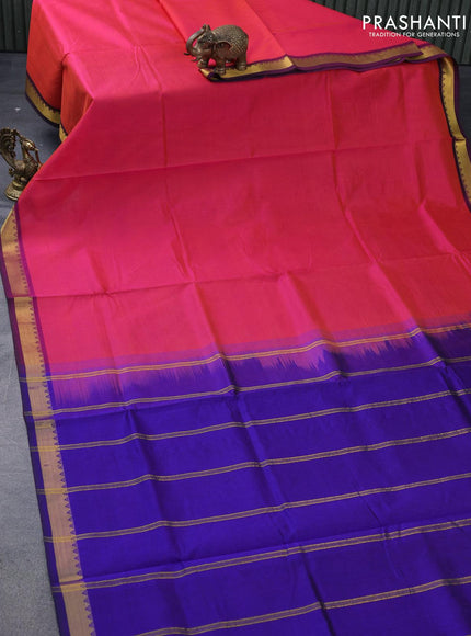 Silk cotton saree dual shade of pinkish orange and blue with plain body and small zari woven border