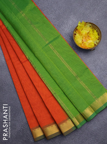 Silk cotton saree rustic orange and green with plain body and small zari woven border