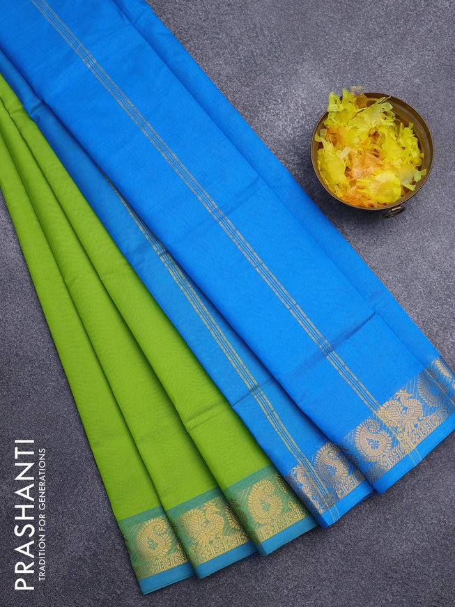 Silk cotton saree parrot green and cs blue with plain body and annam & paisley zari woven border