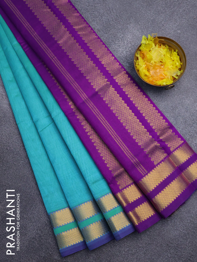 Silk cotton saree dual shade of teal blue and purple with plain body and rettapet zari woven border