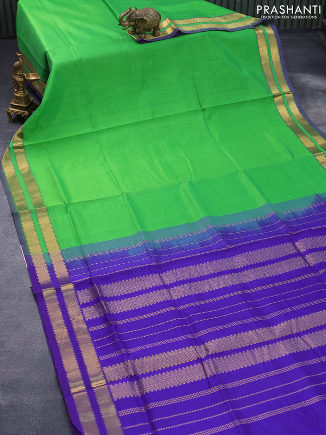 Silk cotton saree light green and violet with plain body and rettapet zari woven border