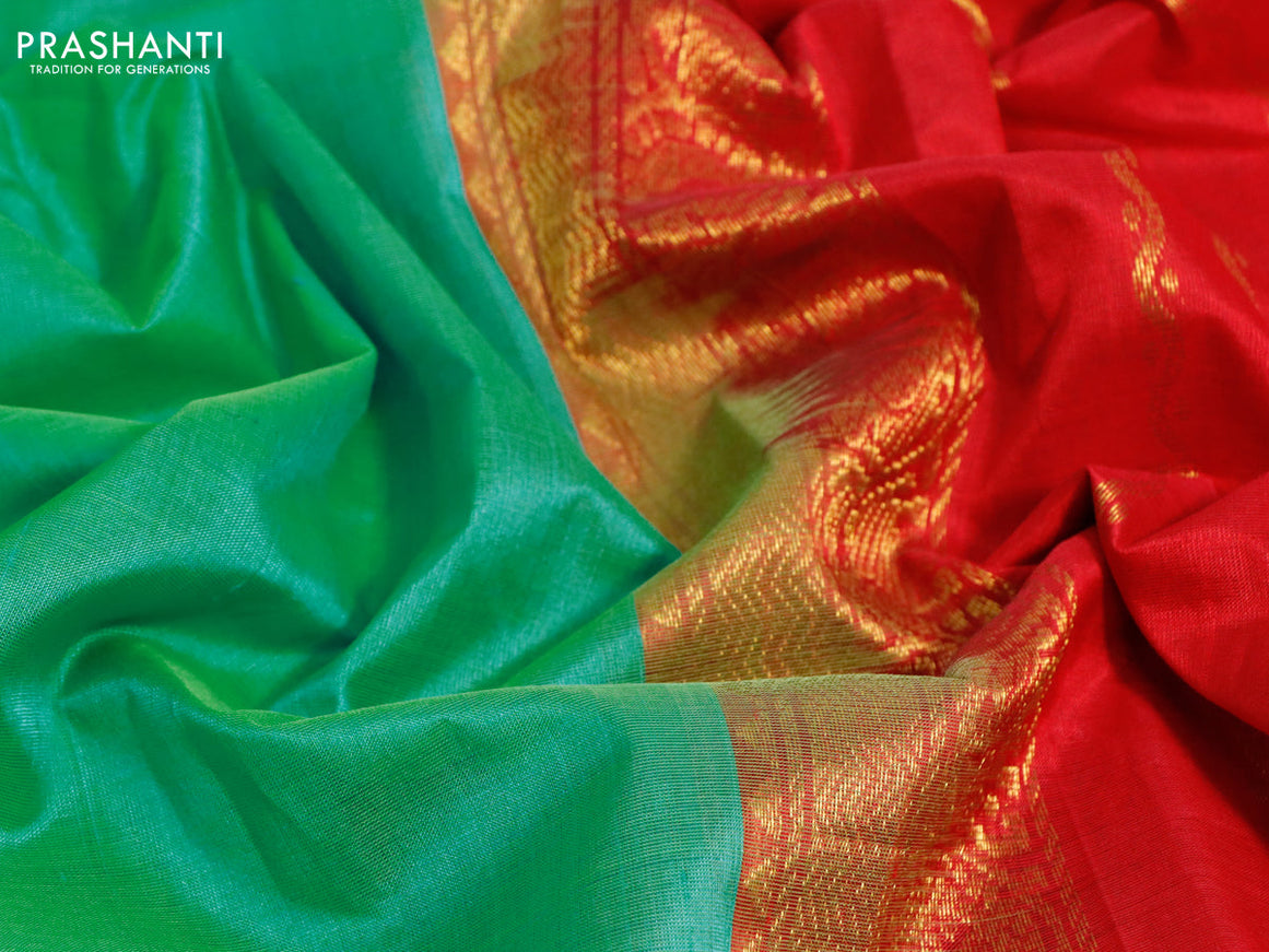 Silk cotton saree teal green and red with plain body and zari woven border