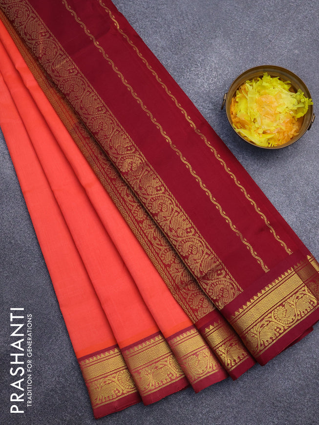 Silk cotton saree orange and maroon with plain body and zari woven border
