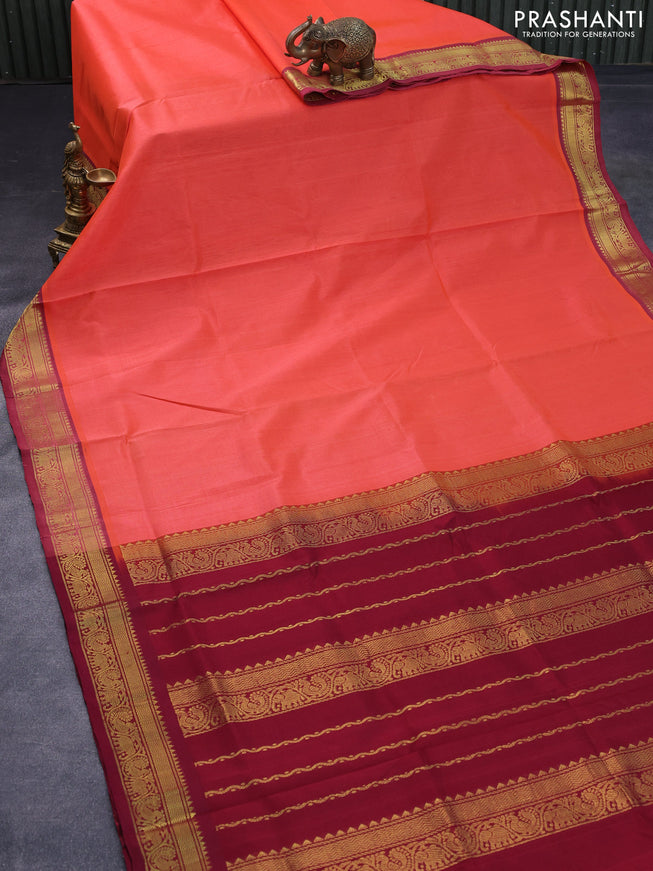 Silk cotton saree orange and maroon with plain body and zari woven border