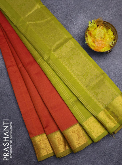 Silk cotton saree sunset orange and light green with plain body and annam zari woven border