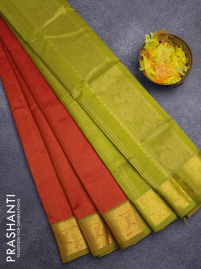 Silk cotton saree sunset orange and light green with plain body and annam zari woven border