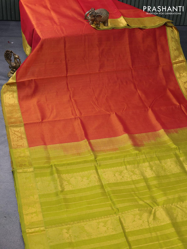 Silk cotton saree sunset orange and light green with plain body and annam zari woven border