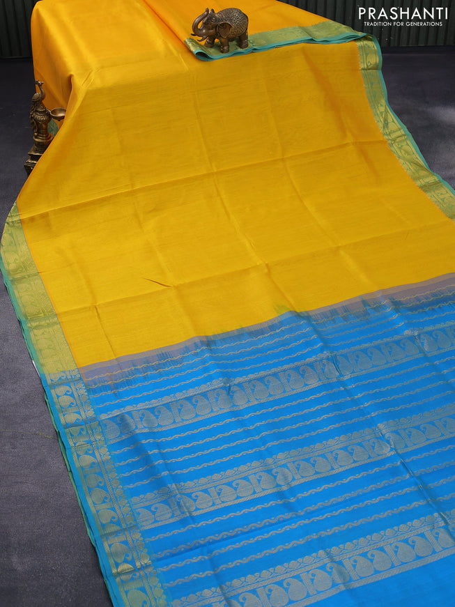 Silk cotton saree yellow and cs blue with plain body and paisley zari woven border